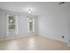 Living room with neutral walls and tile floors at 6370 Golden Dewdrop Trl, Windermere, FL 34786