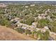 Aerial view of residential neighborhood with quiet street and surrounding nature at 6616 Nw 60Th St, Ocala, FL 34482