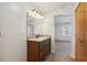 Bathroom with granite countertop, dark wood vanity, and mirror at 6616 Nw 60Th St, Ocala, FL 34482