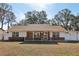 Brick ranch house with carport and fenced yard at 6616 Nw 60Th St, Ocala, FL 34482