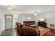 Relaxing living room with hardwood floors and brown couches at 6616 Nw 60Th St, Ocala, FL 34482