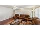 Living room with hardwood floors and reclining furniture at 6616 Nw 60Th St, Ocala, FL 34482