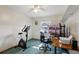 Home office with desk, multiple monitors, and exercise bike at 6616 Nw 60Th St, Ocala, FL 34482