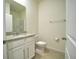 Small bathroom with toilet and single vanity at 6946 Audobon Osprey Cv, Harmony, FL 34773