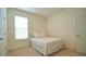 Simple bedroom with full-size bed and closet at 6946 Audobon Osprey Cv, Harmony, FL 34773