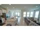 Bright living room with large windows and comfortable sectional sofa at 6946 Audobon Osprey Cv, Harmony, FL 34773