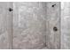 Shower with gray tiled walls and modern shower fixtures at 7080 Hemlock Crse, Ocala, FL 34472