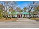 Charming single story home with a green metal roof and spacious yard at 750 S Dudley Ave, Bartow, FL 33830