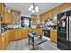 Kitchen with wood cabinets and a kitchen island at 750 S Dudley Ave, Bartow, FL 33830