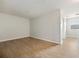 Bright bedroom with wood-look floors and large window at 7525 Azalea Cove Cir, Orlando, FL 32807