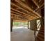 Partially completed garage includes block walls, exposed wood framing, an unfinished concrete floor, and stairs to the second story at 785 N Phelps Ave, Winter Park, FL 32789