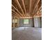 Unfinished interior showcasing concrete flooring, block walls, and exposed wood beams, full of potential at 785 N Phelps Ave, Winter Park, FL 32789