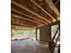 Open concept interior with concrete flooring, block walls, and exposed wood beams, bathed in natural light at 785 N Phelps Ave, Winter Park, FL 32789