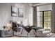 Serene bedroom featuring neutral tones, a plush bed, large windows, and stylish decor at 785 N Phelps Ave, Winter Park, FL 32789