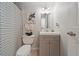 Clean bathroom with gray vanity and striped shower curtain at 805 Weldona Ln # 104, Orlando, FL 32801