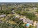 Aerial shot of property in a green neighborhood; property lines indicated in white at 8620 Willow Kane Ct, Orlando, FL 32835