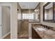 Bathroom featuring a stone-tile shower and updated vanity at 8620 Willow Kane Ct, Orlando, FL 32835