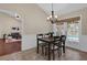 Dining area with a view of the pool and living room at 8620 Willow Kane Ct, Orlando, FL 32835