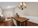 Bright dining room features stylish light fixture and hardwood flooring at 8620 Willow Kane Ct, Orlando, FL 32835