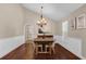 Dining room features high ceilings, stylish chandelier, and wainscotting at 8620 Willow Kane Ct, Orlando, FL 32835