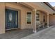 Inviting front porch with seating, decorative pillars, and a stylish front door with glass detailing at 8620 Willow Kane Ct, Orlando, FL 32835