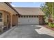 Spacious garage with a large driveway and carriage doors at 8620 Willow Kane Ct, Orlando, FL 32835