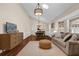 Open living and dining area featuring a beamed ceiling and lots of natural light at 8620 Willow Kane Ct, Orlando, FL 32835