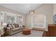 Cozy living room featuring a bay window and a vaulted ceiling at 8620 Willow Kane Ct, Orlando, FL 32835