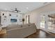 Spacious living room with built-in shelving and doors leading to the pool at 8620 Willow Kane Ct, Orlando, FL 32835