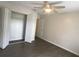 Bright bedroom with large closet and dark laminate flooring at 90 Moree Loop # 16, Winter Springs, FL 32708