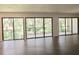 Bright living area with sliding doors showcasing a tree-filled view at 90 Moree Loop # 16, Winter Springs, FL 32708