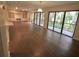 Spacious living room with wood-look floors and sliding doors to balcony at 90 Moree Loop # 16, Winter Springs, FL 32708