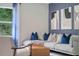 Living room with gray sofa and blue pillows at 936 Parc Hill Blvd, Orange City, FL 32763