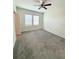 Spacious bedroom with ceiling fan and neutral carpeting at 9884 Red Eagle Dr, Orlando, FL 32825