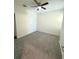 Bedroom with ceiling fan and neutral-colored carpet at 9884 Red Eagle Dr, Orlando, FL 32825