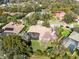 Aerial view of the property showcasing a lush backyard and screened-in pool at 103 Arrowhead Ct, Winter Springs, FL 32708