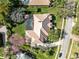 An aerial view of the property showcasing the expansive backyard and pool at 103 Arrowhead Ct, Winter Springs, FL 32708