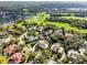 Aerial view of the community featuring lush golf course and mature trees at 103 Arrowhead Ct, Winter Springs, FL 32708