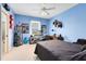 Blue bedroom with unique decor, ceiling fan, and natural light at 103 Arrowhead Ct, Winter Springs, FL 32708