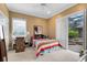 Cozy bedroom featuring neutral tones, sliding doors to the pool area, and plush carpet at 103 Arrowhead Ct, Winter Springs, FL 32708