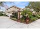 Exterior view showcasing architectural details, driveway, landscaping, and garage at 103 Arrowhead Ct, Winter Springs, FL 32708