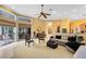 A large living area features lots of light, tile floors, and decor at 103 Arrowhead Ct, Winter Springs, FL 32708