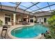 Sparkling pool featuring a rock waterfall, a covered lanai, and plenty of space for lounging at 103 Arrowhead Ct, Winter Springs, FL 32708