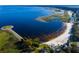 Aerial view of waterfront park with beach and walking path at 1114 Wyoming Ave, St Cloud, FL 34769