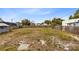 Large backyard with grassy area and fire pit at 1114 Wyoming Ave, St Cloud, FL 34769