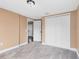 Bedroom with carpet flooring and double door closet at 1114 Wyoming Ave, St Cloud, FL 34769