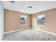 Bright bedroom with neutral walls and carpet flooring at 1114 Wyoming Ave, St Cloud, FL 34769