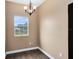 Bright dining room with chandelier and hardwood floors at 1114 Wyoming Ave, St Cloud, FL 34769