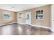 Bright living room with hardwood floors and neutral walls at 1114 Wyoming Ave, St Cloud, FL 34769