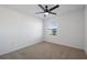 Bright bedroom featuring carpet flooring and a ceiling fan at 11574 Buoy Point Pl, Orlando, FL 32832